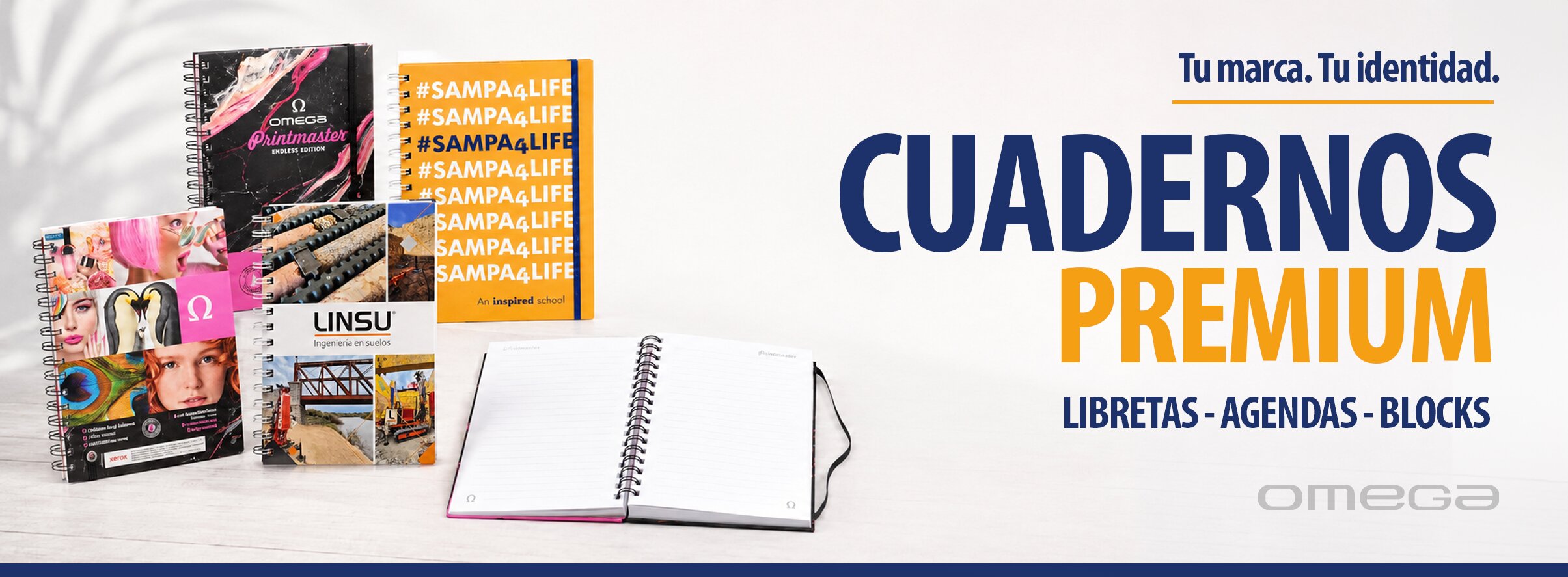 Colección de cuadernos premium personalizados, agendas, libretas y blocks impresos con tapa dura, espiral metálico y acabados de alta calidad fabricados por Imprenta Omega.